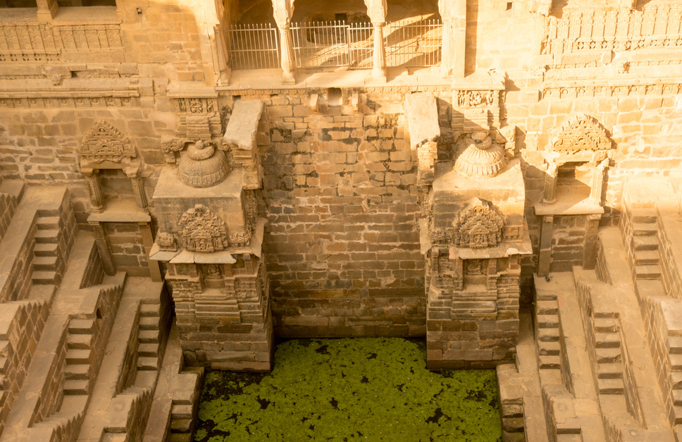 Steps leading down to the green water in abhaneri rajasthan